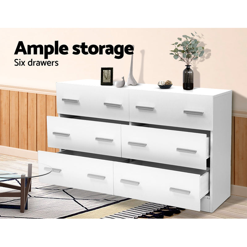 6 Drawer Lowboy Storage Dresser White with six open drawers, simple handles, and decorative items on top in a bedroom setting