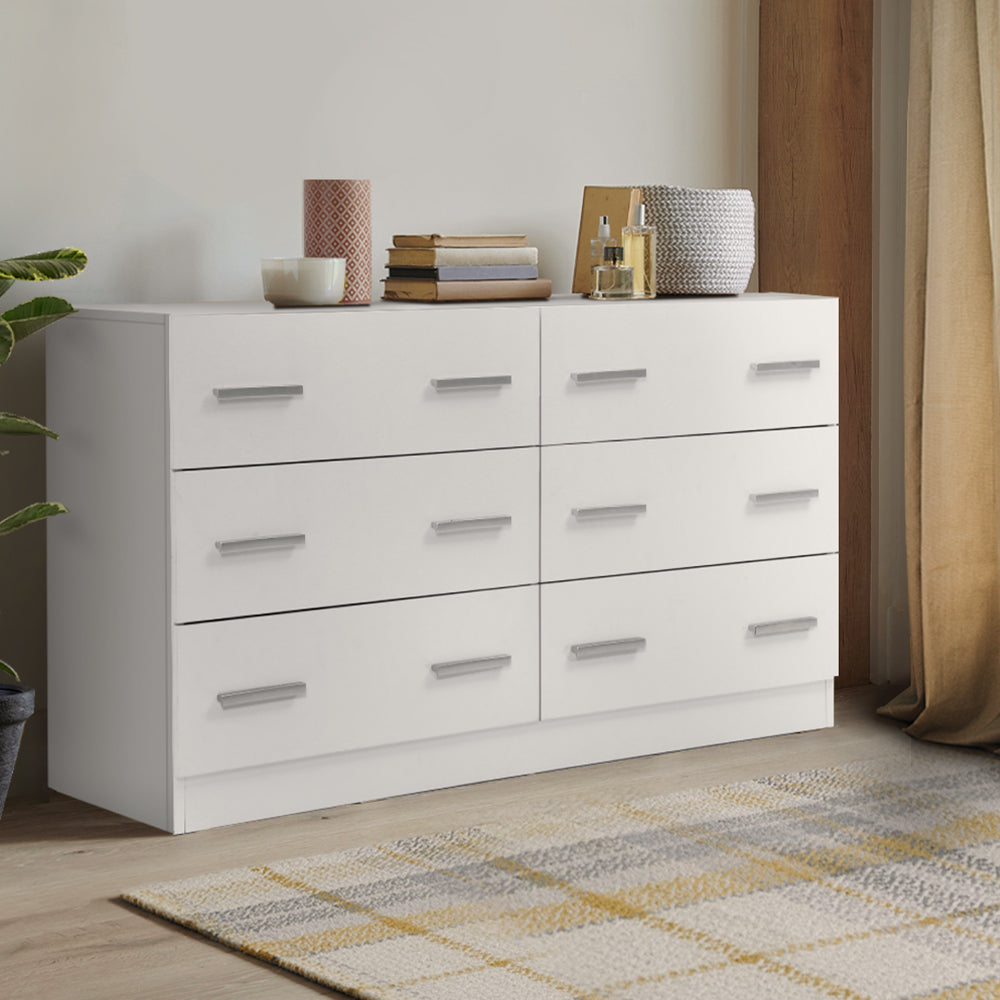 6 Drawer Lowboy Storage Dresser White with sleek handles, melamine finish, styled with decor on top in bedroom setting