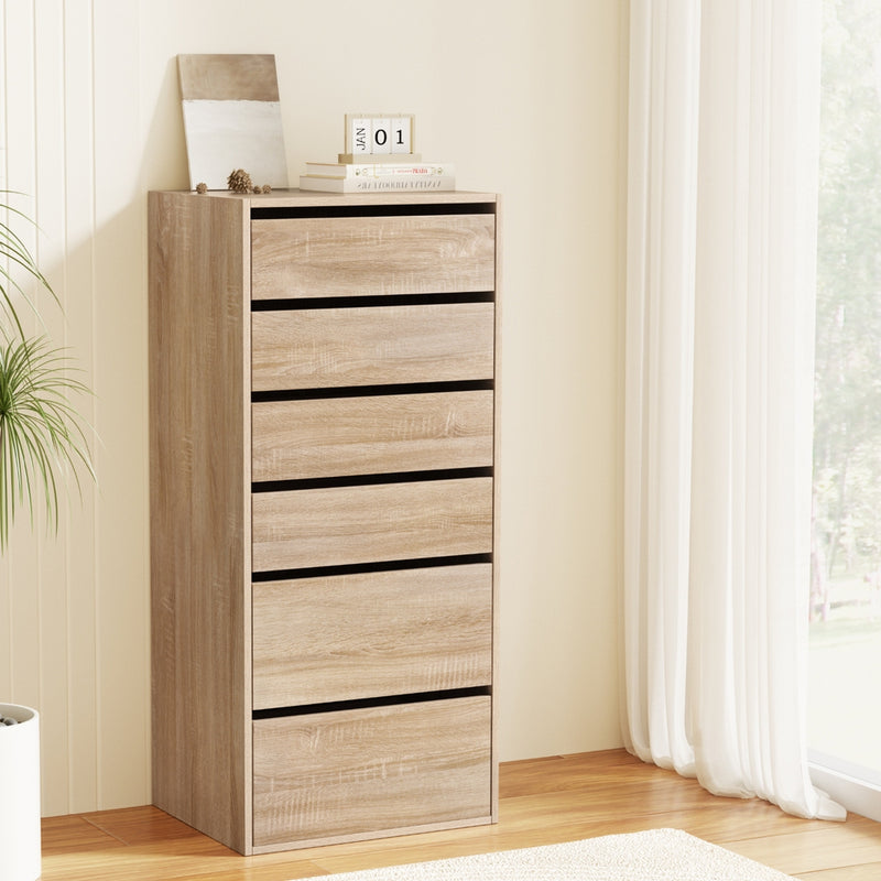 6 Chest of Drawers Dresser Tallboy Pine with six spacious drawers in a light pine finish, shown in bright room setting