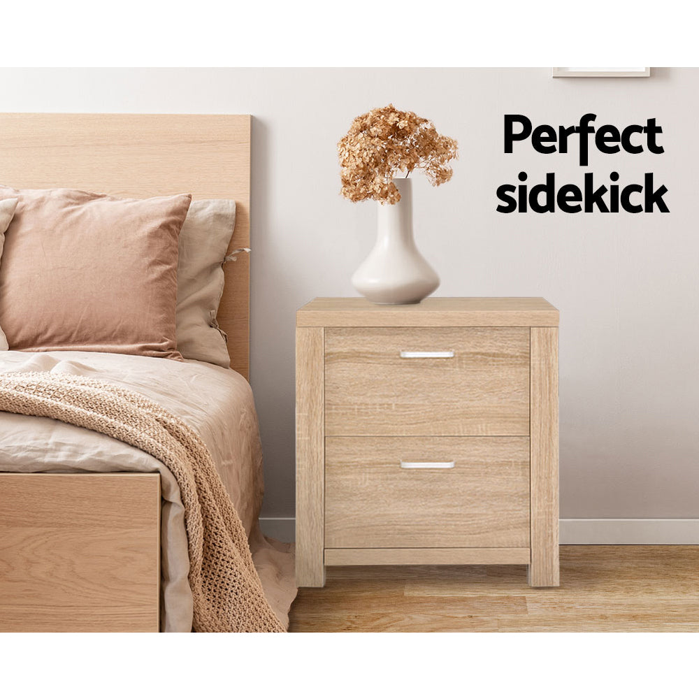 2x Bedside Table 2 Drawers - MAXI Pine twin pack with silver handles, natural pine finish, styled beside bed with vase and dried flowers