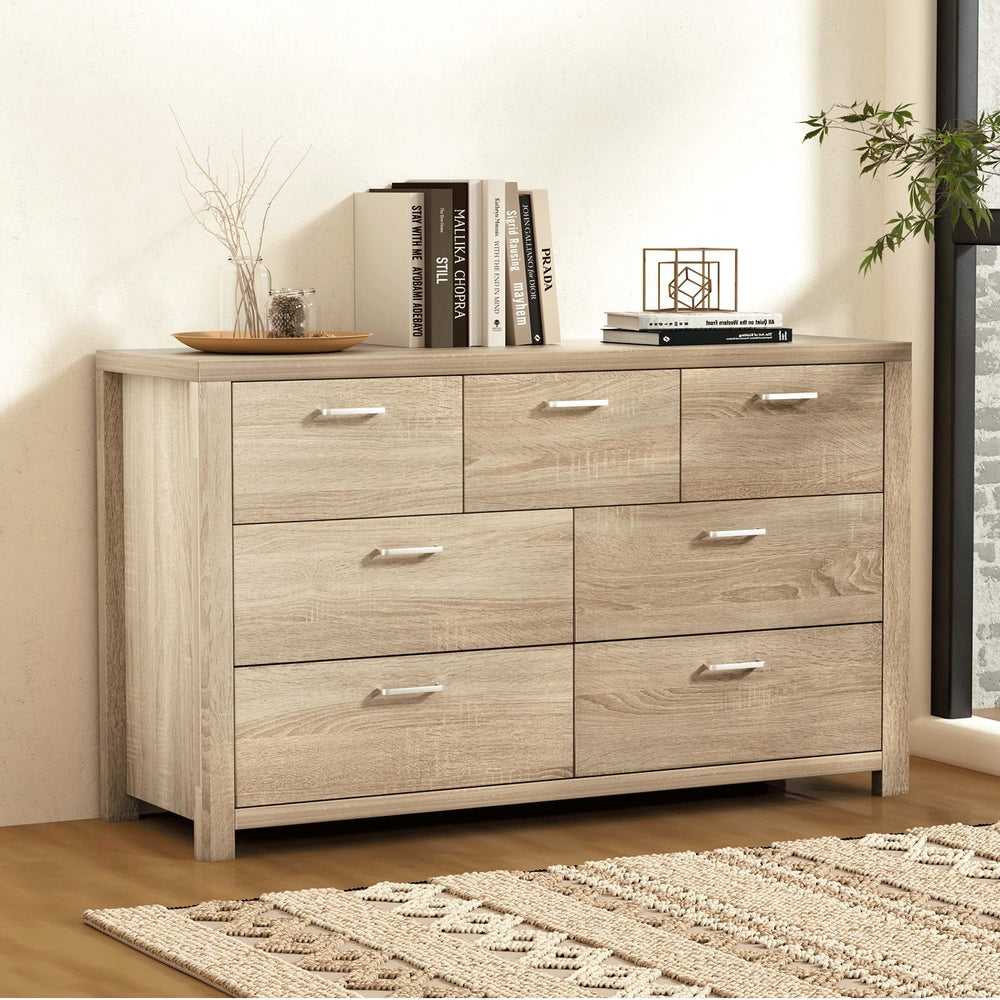 7 Drawer Lowboy Storage Dresser Oak with metal handles, spacious drawers, and light oak finish in styled bedroom setting