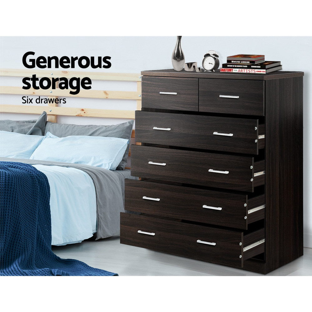 6 Drawer Tallboy Walnut bedroom furniture with six spacious drawers, dark wood finish, and silver handles next to bed