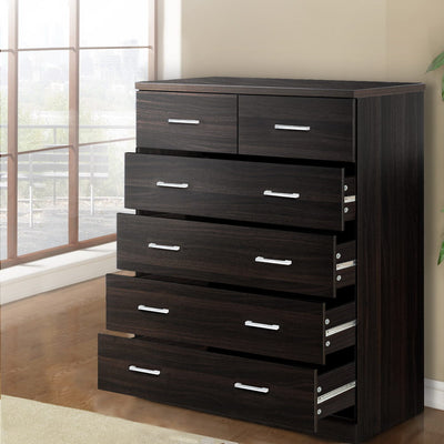 6 Drawer Tallboy Walnut with a dark wood finish, featuring sleek silver handles and four drawers partially open in a bedroom setting