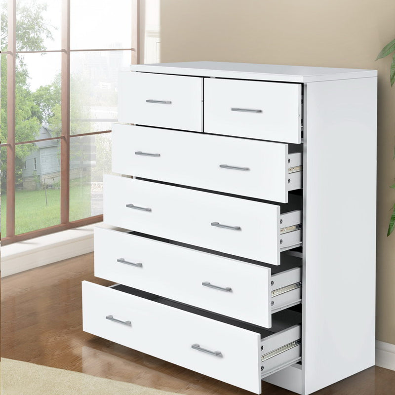 6 Drawer Tallboy White with silver handles, open drawers showing smooth metal runners, in a bright bedroom setting