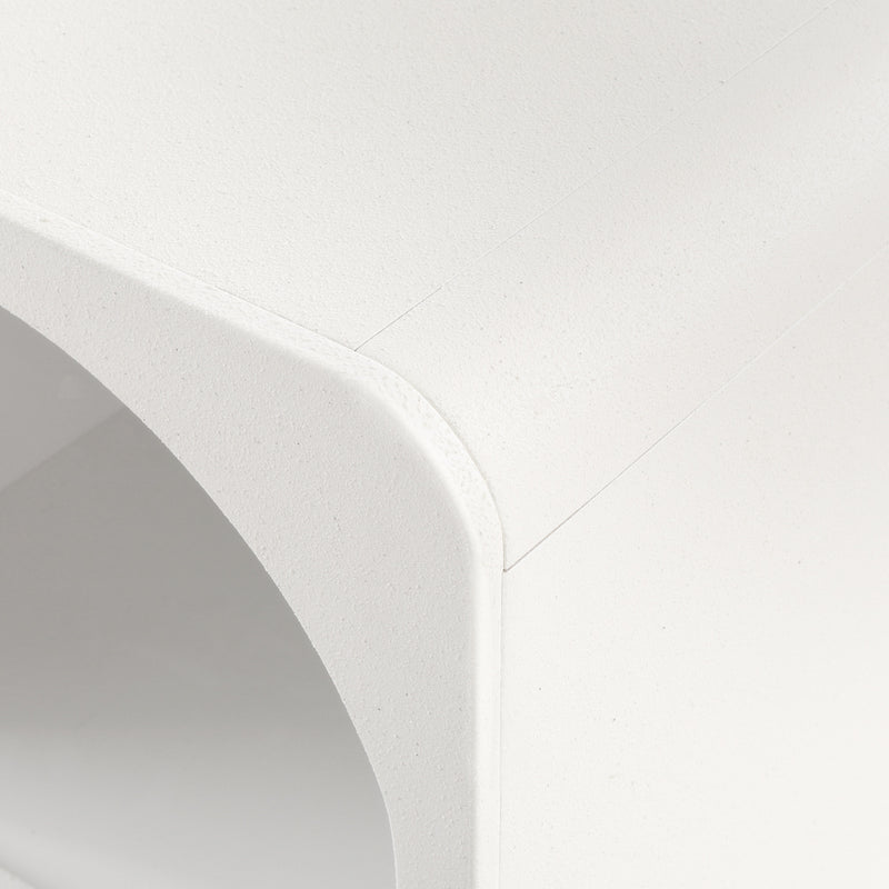 Close-up of the textured surface and curved edge of the Arched Textured Bedside Table White for bedroom furniture.