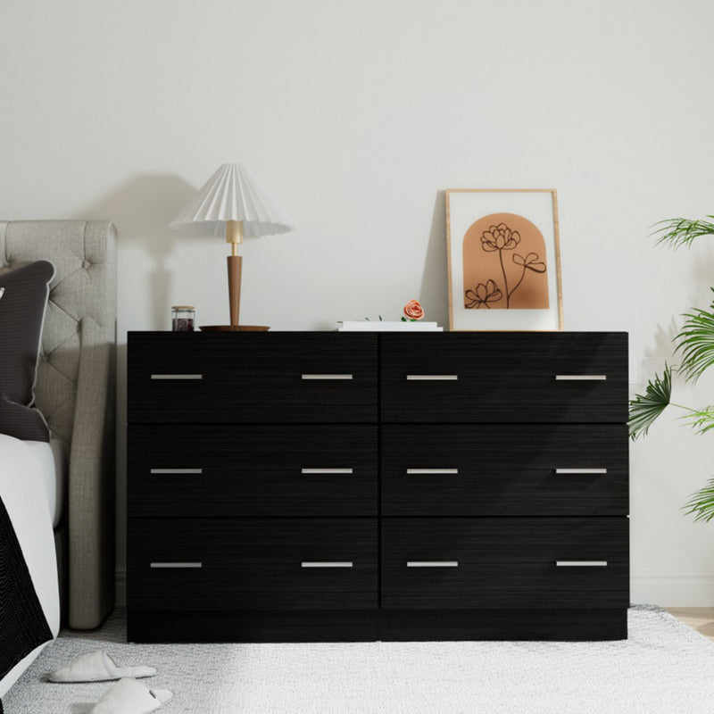 6 Drawer Lowboy Dresser - Black with silver handles, styled with lamp and framed art in modern bedroom setting