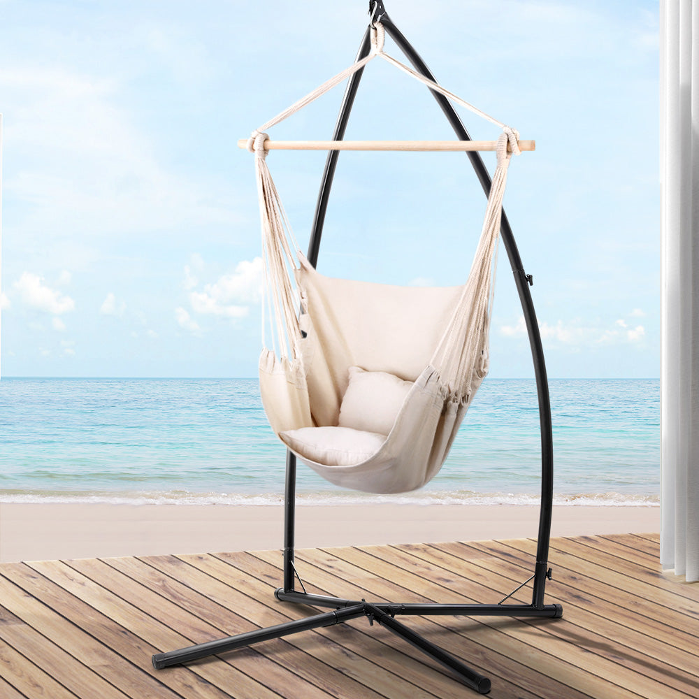 Outdoor Hammock Chair with Steel Stand Hanging Hammock with Pillow Cream on wooden deck by the ocean view