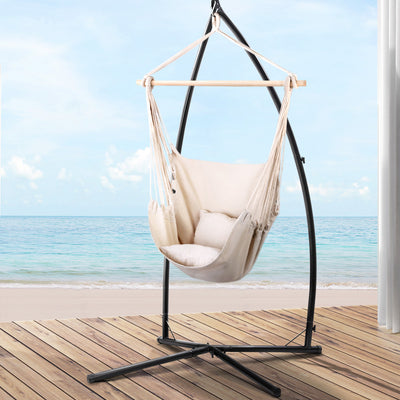 Outdoor Hammock Chair with Steel Stand Hanging Hammock with Pillow Cream on wooden deck by the ocean view