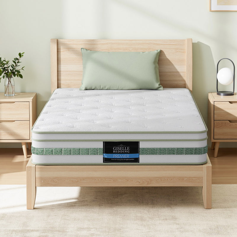 Mint Series Euro Top Mattress 20cm Thick – Single on wooden bed frame with bedside tables and a green pillow in bedroom setting
