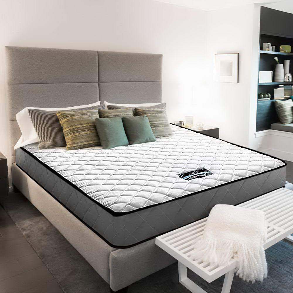 Alzbeta Bonnell Spring Mattress 16cm Thick - King Single on upholstered bed frame with pillows and bench in modern bedroom