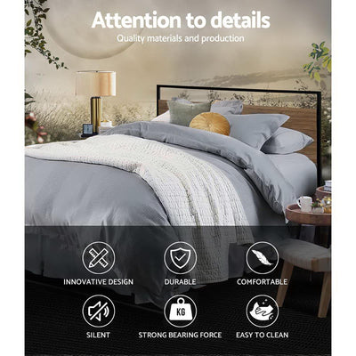 Stockton Double Bed Frame with black metal and wood headboard, styled with gray bedding in a bedroom setting