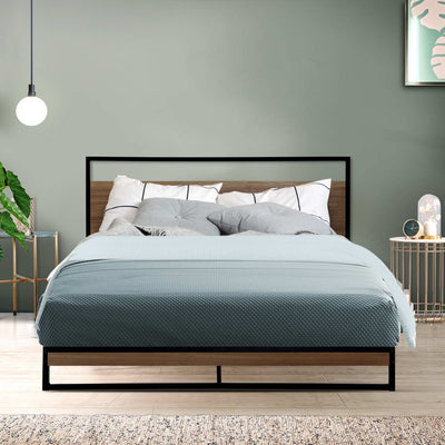 Stockton Double Bed Frame with black metal frame and wooden headboard, styled with blue bedding and pillows in bedroom setting