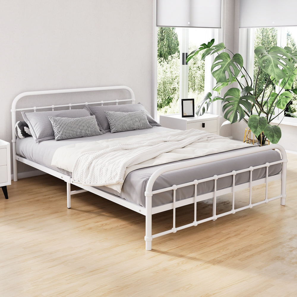 Leo Metal Double Bed Frame White in modern bedroom setting with gray bedding and bedside tables with plants