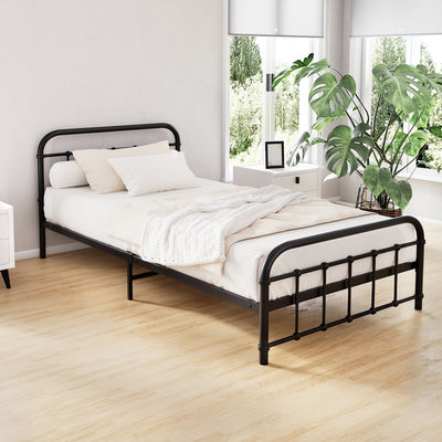 Leo Metal King Single Bed Frame Black with minimalist steel design in bright bedroom setting with white bedding and plants