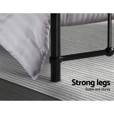 Close-up of black metal leg on the Leo Metal Queen Bed Frame Black showing sturdy construction on a textured rug