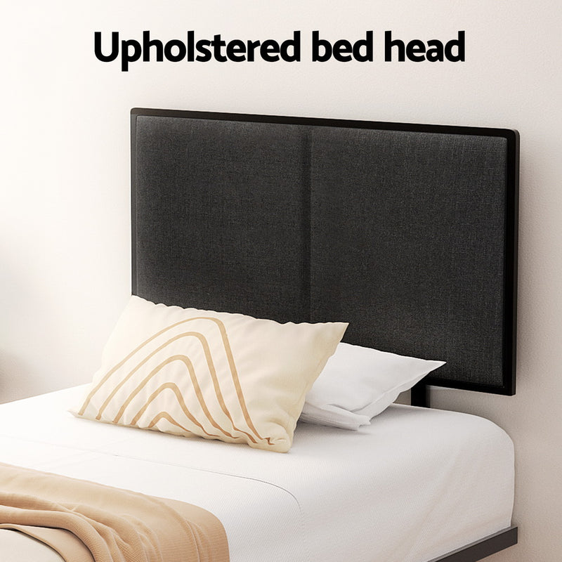 Kembla Metal King Single Bed Frame Black with upholstered headboard, white bedding, and beige accent pillow in a bedroom setting.