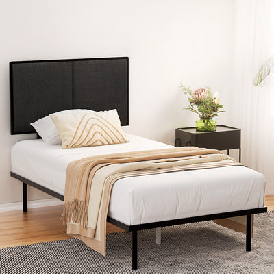 Kembla Metal King Single Bed Frame Black with black upholstered headboard, white bedding, beige throw, and bedside table with flowers