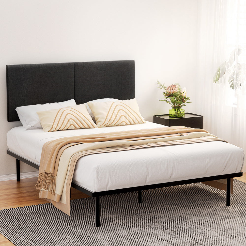 Norwood Queen Modern Bed Frame Black with upholstered headboard, black metal frame, styled with white bedding and beige throw blanket