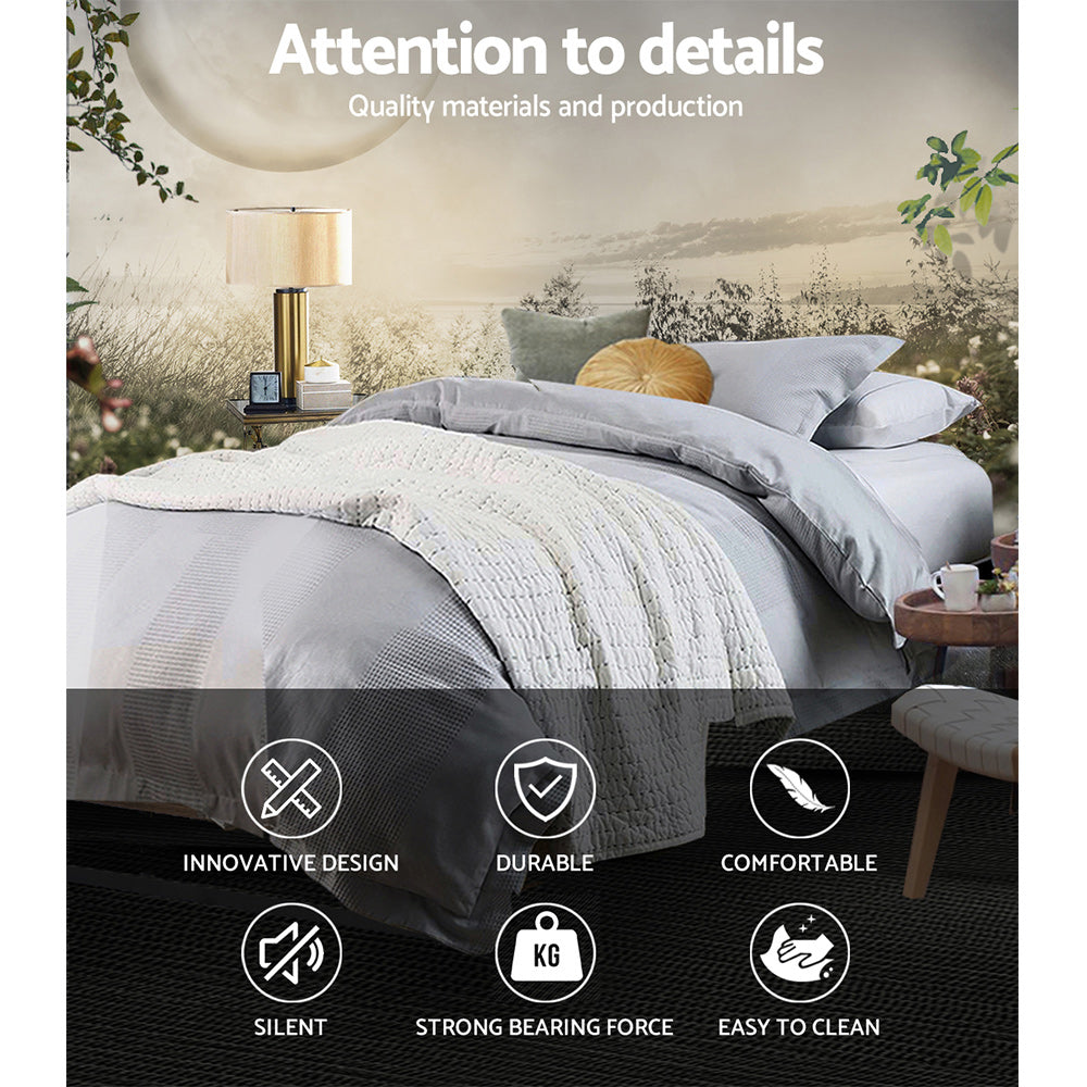 Oslo Metal & Wood King Single Bed Frame in black with bedding, bedside table, lamp, and decorative cushions in bedroom setting