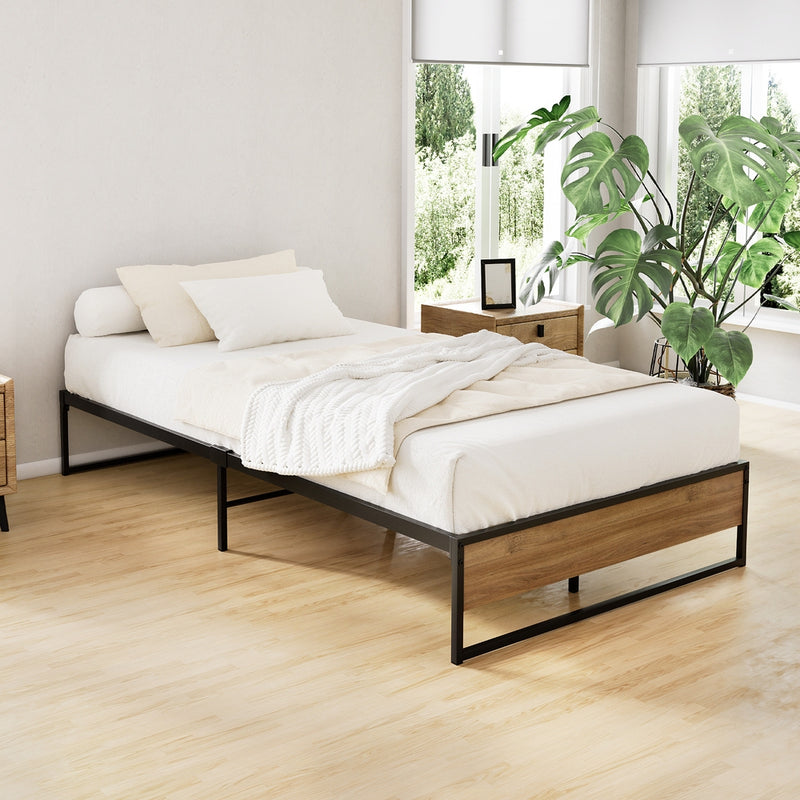 Oslo Metal & Wood King Single Bed Frame with black metal frame and wooden panels in a bright, minimalist bedroom setting