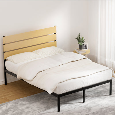 Paula Double Metal Bed Frame Black With Wooden Headboard in bedroom setting with white bedding and side table