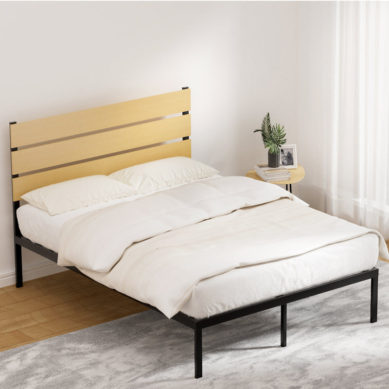 Paula Double Metal Bed Frame Black With Wooden Headboard in bedroom setting with white bedding and side table