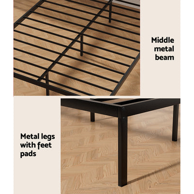 Paula Double Metal Bed Frame Black With Wooden Headboard showing metal slats, middle beam, and legs with feet pads on wood floor