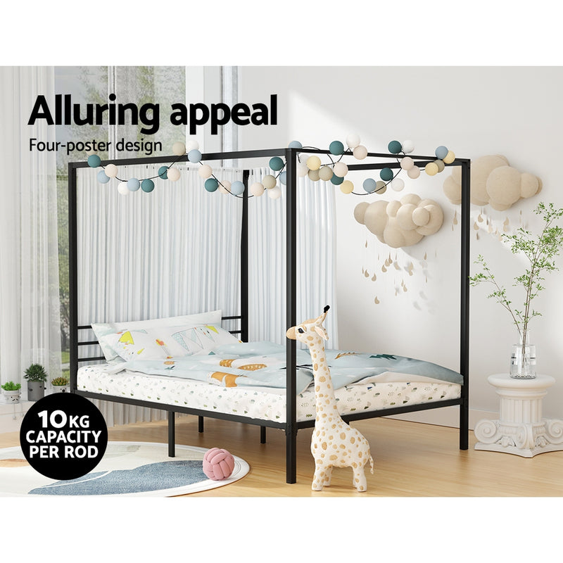 Metal Four Poster Queen Size Bed Frame Black with string lights, bedroom decor, and plush giraffe toy on wood floor