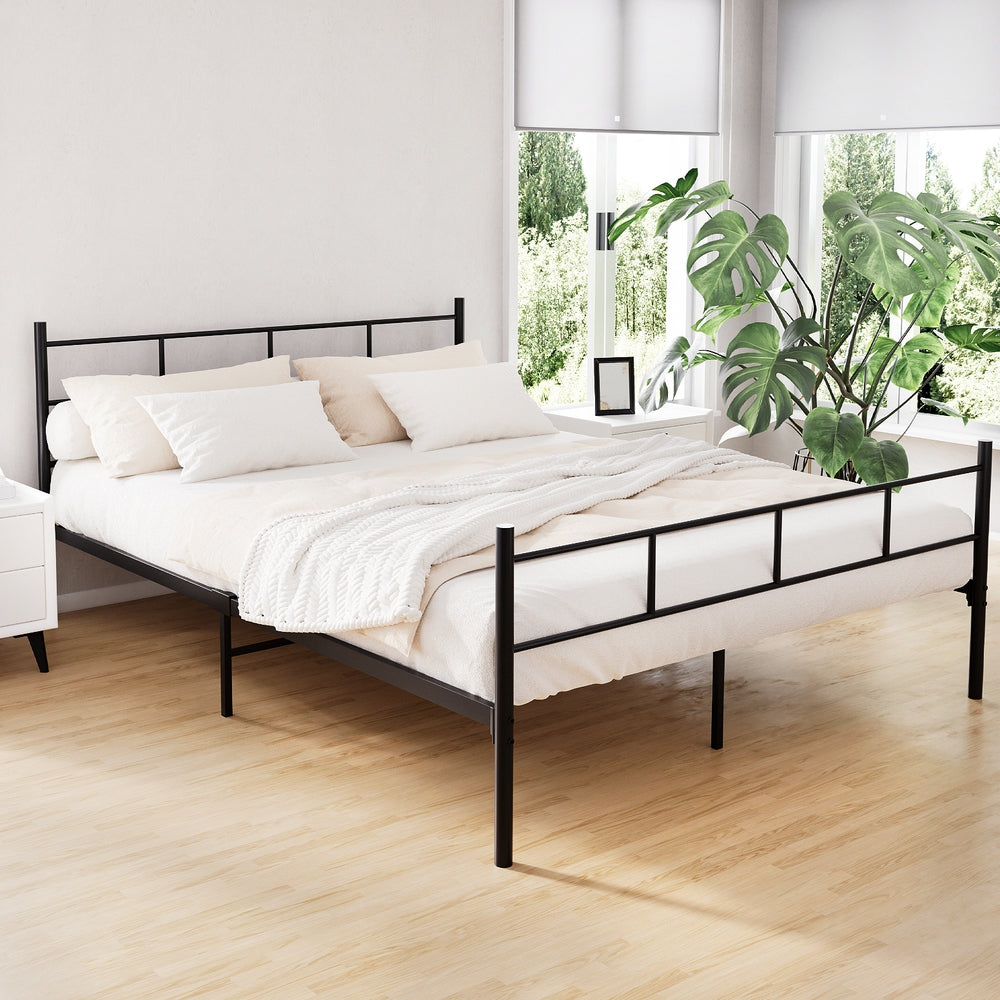 Wategos Metal Queen Bed Frame Black with simple black steel design in a bright bedroom setting with neutral bedding and green plant