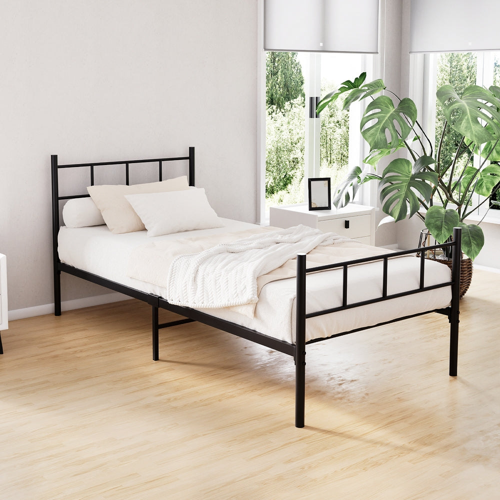 Wategos Metal Single Bed Frame Black in sleek steel with minimalist design set in a bright bedroom with plants and natural light