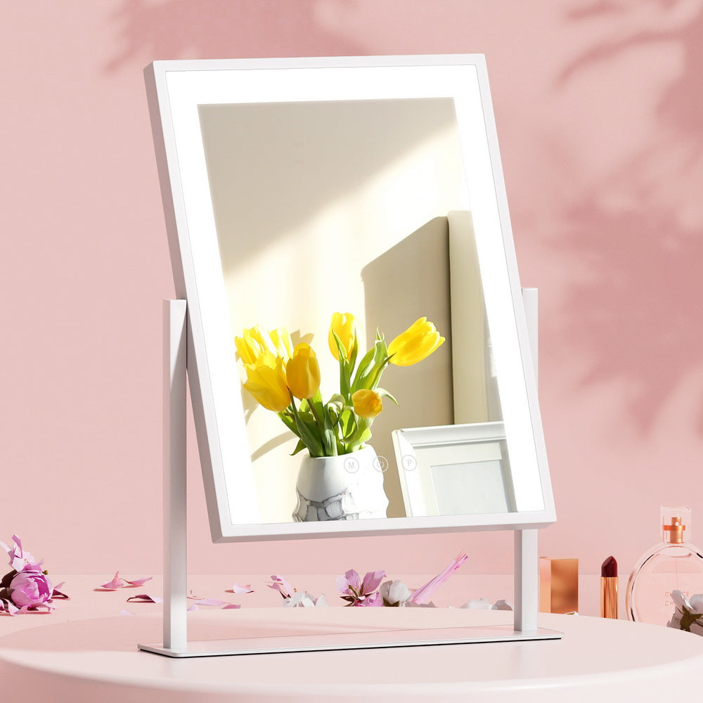 Makeup Mirror 30x40cm Hollywood Vanity with LED Light Rotation White on pink surface with decorative flowers and perfume bottles