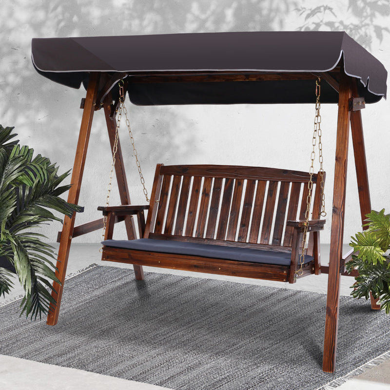 Wooden Swing Chair Garden Bench Canopy 3 Seater Outdoor Furniture with dark cushions and metal chains on gray rug