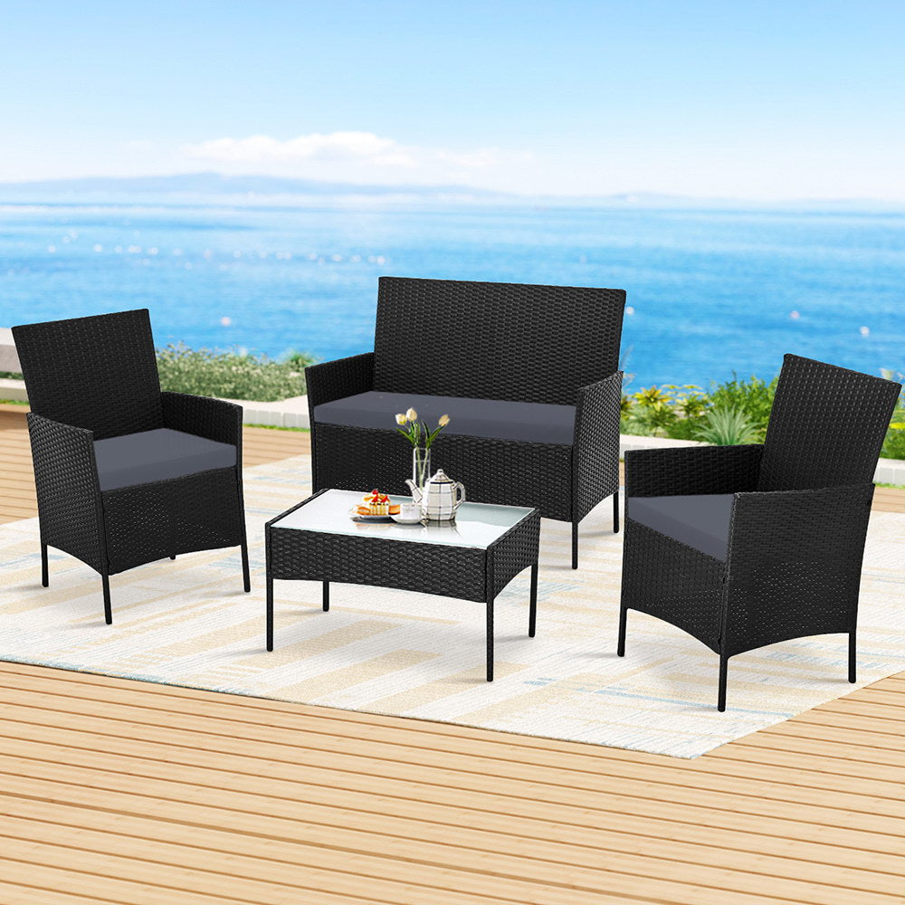 4 Seater Outdoor Sofa Set Wicker Setting Table Chair Furniture Dark Grey with cushions on patio by the sea