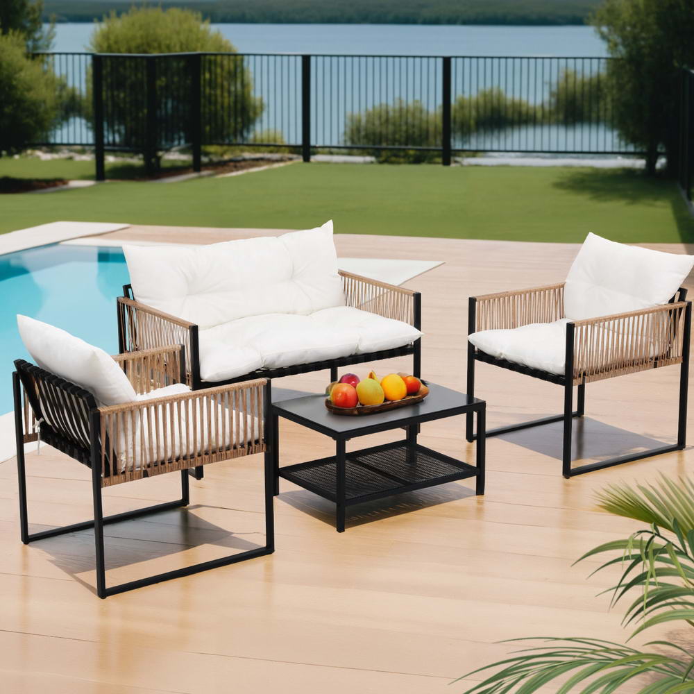 4-Piece Rattan Style Outdoor Sofa Set with Table - Black Frame & White Cushions by pool with fruit on table, modern design