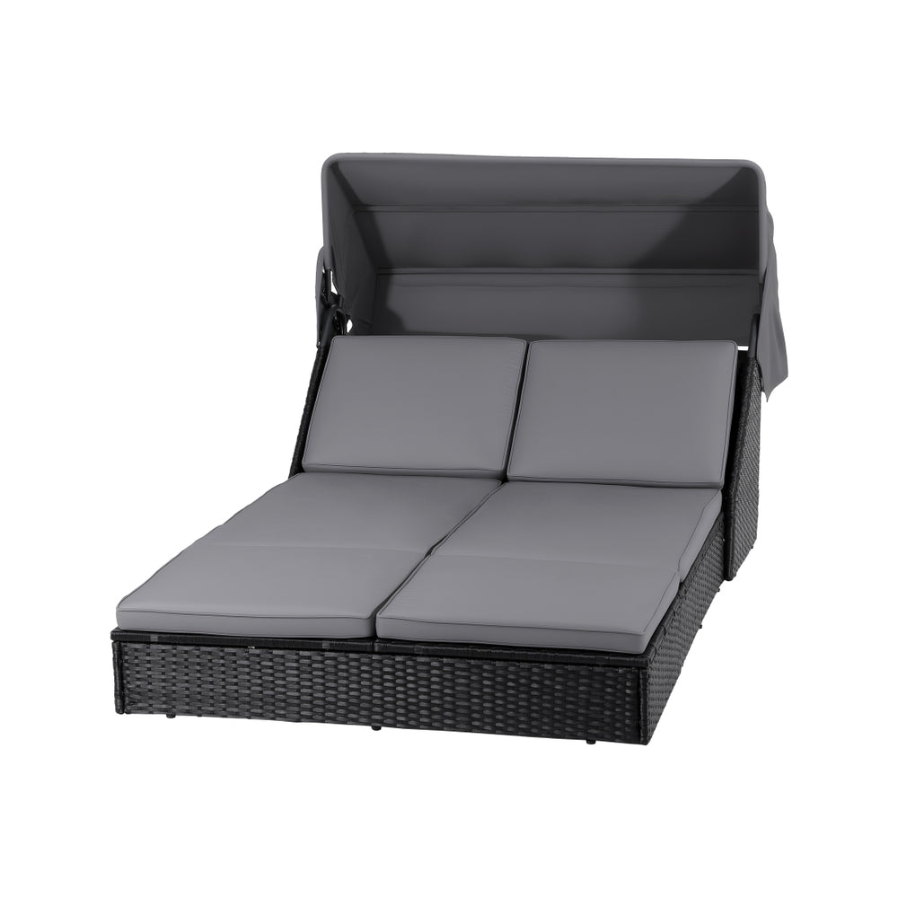 Outdoor Day Bed Sun Lounge Setting Wicker Lounger Patio Furniture with adjustable canopy and gray cushions on black background