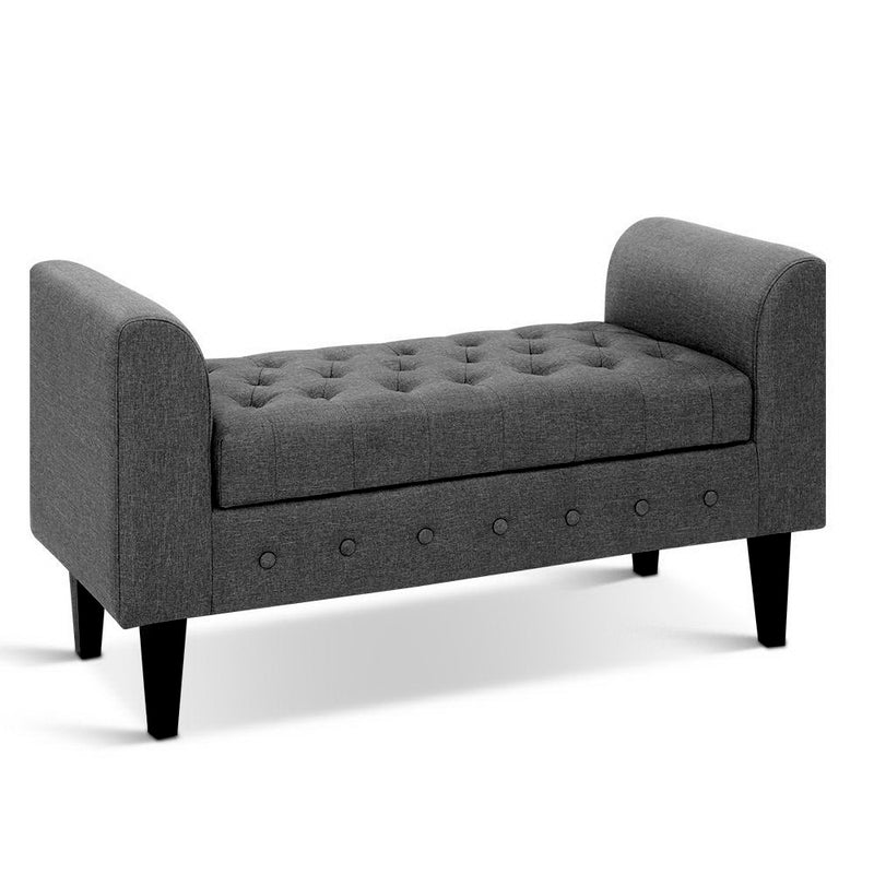 Fabric Storage Ottoman - Grey with tufted top, curved armrests, and black legs, ideal for bedroom furniture by Bedzy.