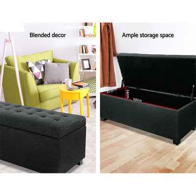 Premium Storage Ottoman - Charcoal with tufted top, ample storage space, and sleek faux linen fabric in bedroom setting