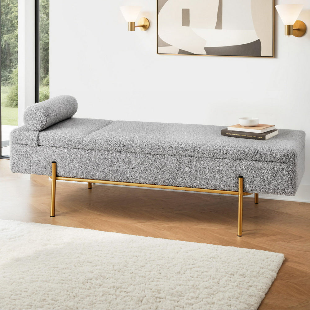 Storage Ottoman Bed 140cm Pillow Foot Stool with gray upholstery, cylindrical pillow, and gold metal legs in modern room setting