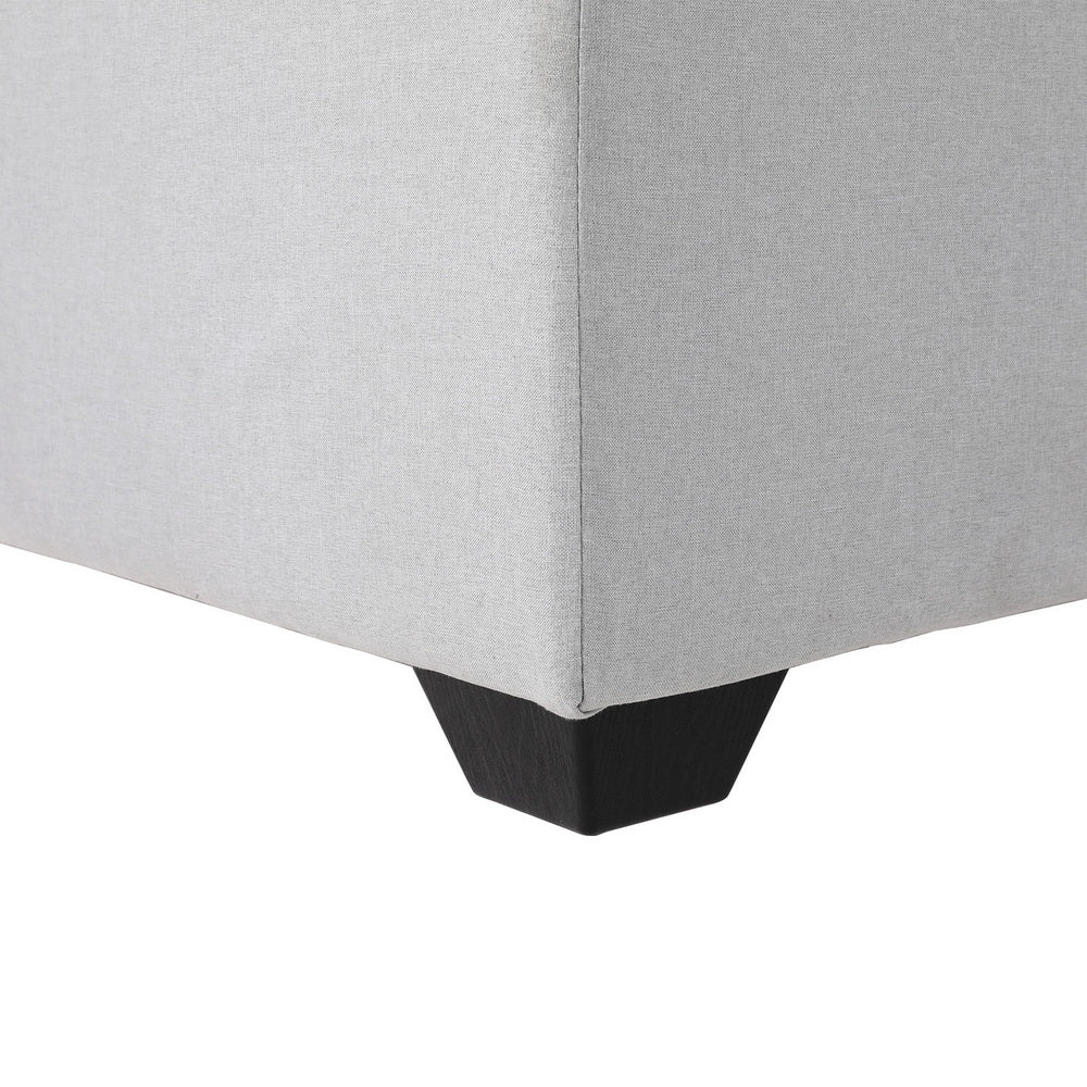 Ottoman Storage Sofa Bed 112cm Foldable Grey with linen upholstery and black tapered wooden leg detail close-up view