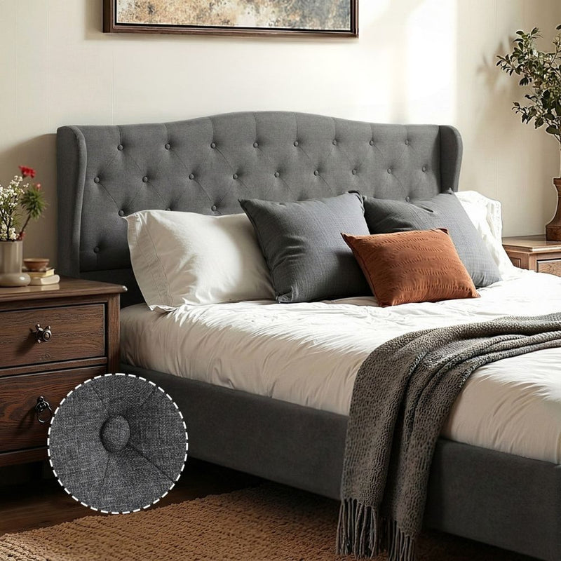 Pierre Double Bed Frame with Wingback Headboard – Grey in bedroom setting with white and grey pillows and wooden furniture