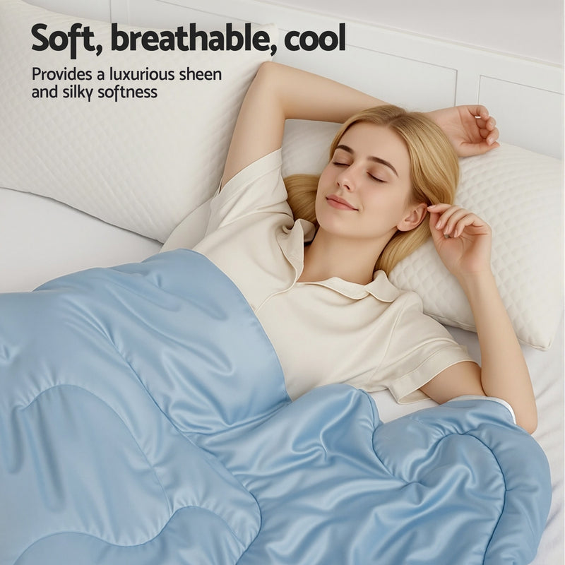 Woman resting under light blue Tencel Quilt 200GSM Summer Quilts Comforter Doona Light Weight Soft Throw Blanket King on white bed