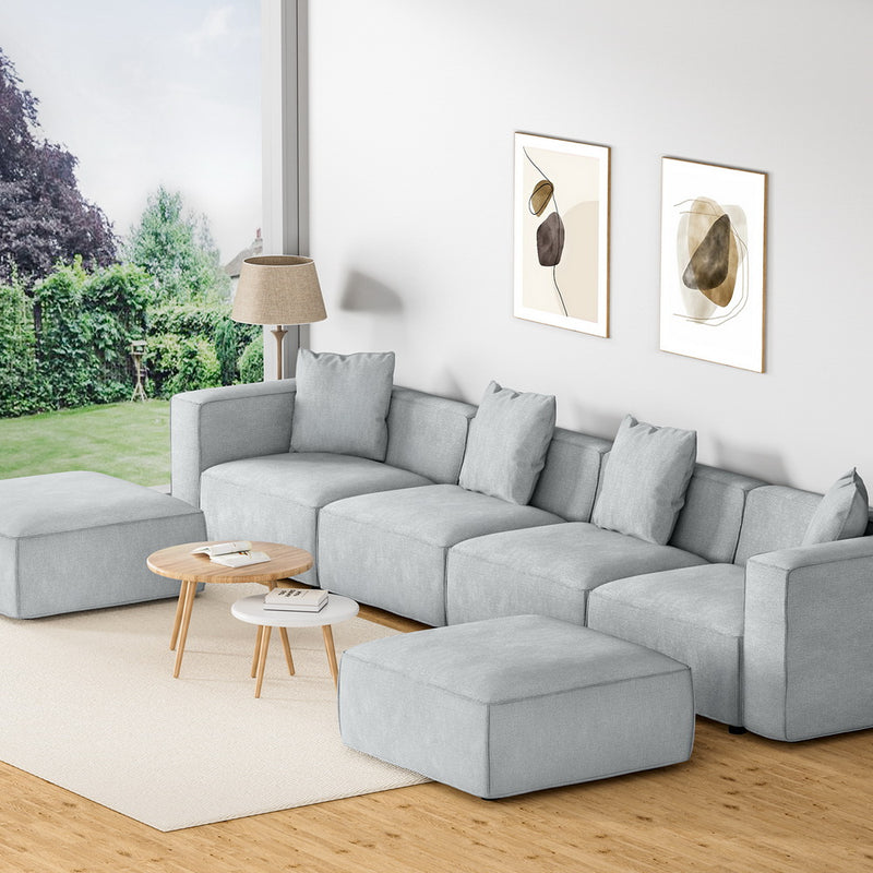 Modular Sofa Chaise Set 6-Seater Grey with soft linen upholstery, five cushions, ottoman, and round wooden coffee tables in modern living room