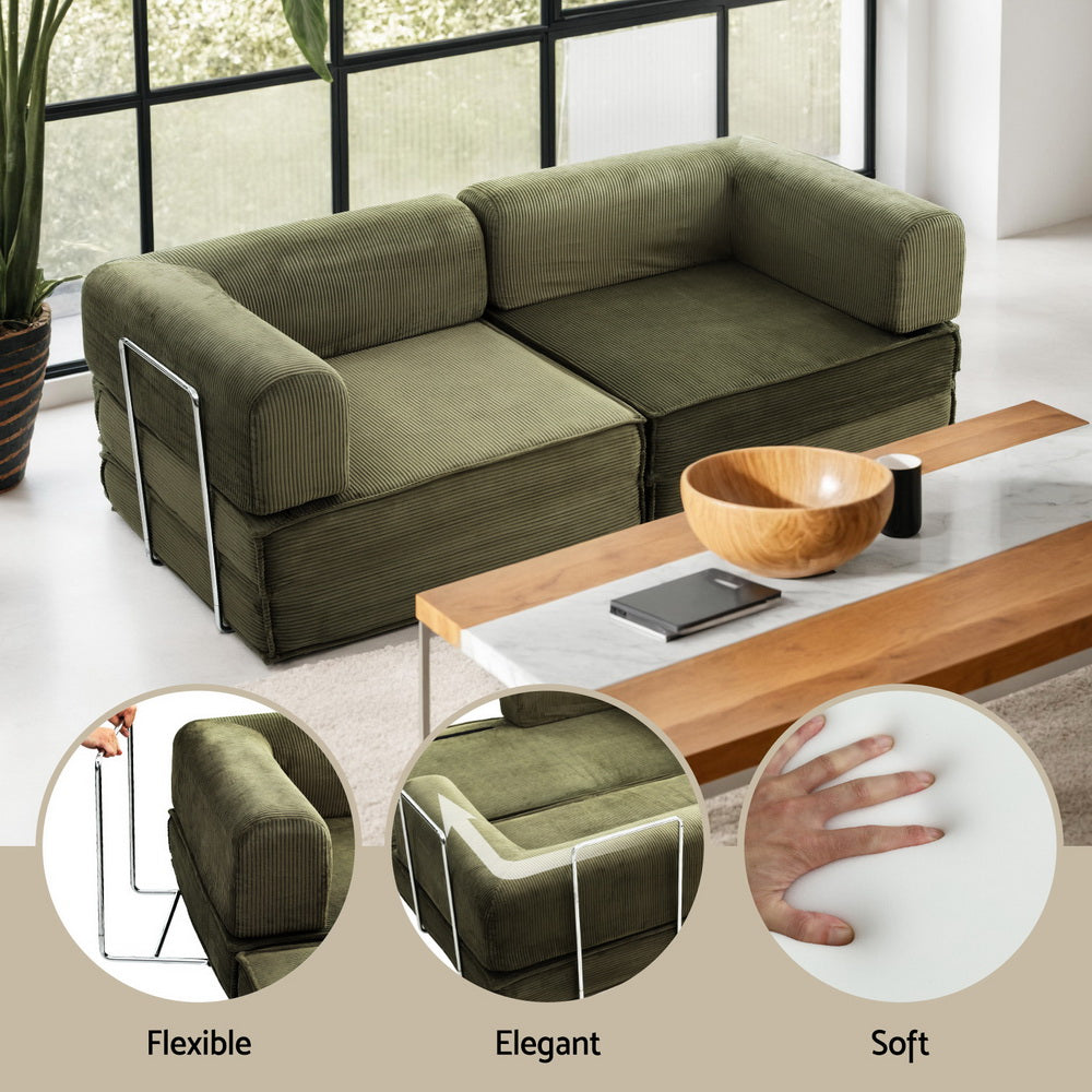 Convertible Folding Sofa Bed Green in corner setup with wooden coffee table, showcasing flexible steel frame and soft cushions.