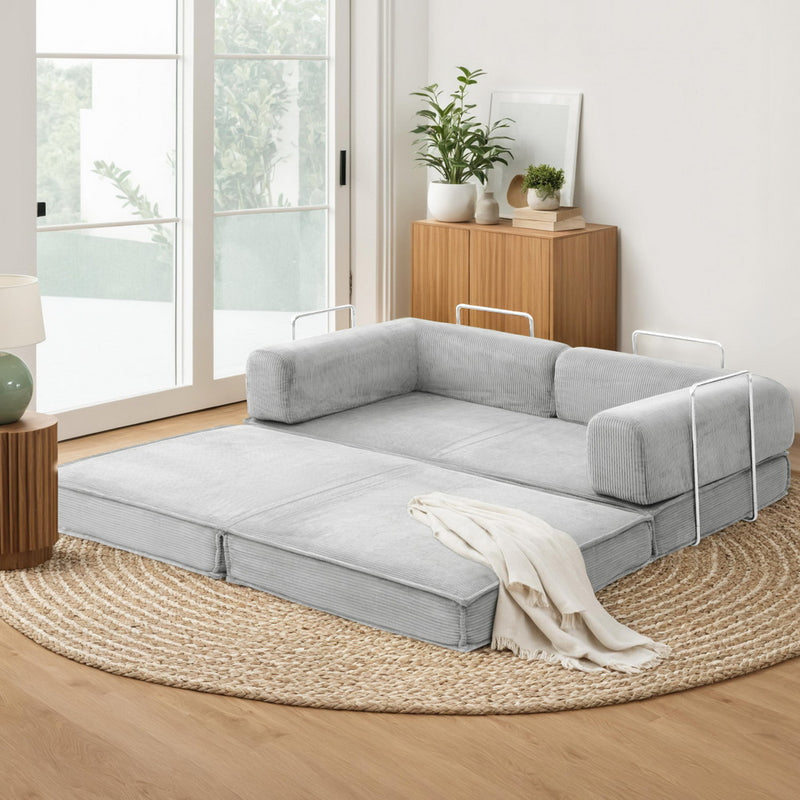Convertible Folding Sofa Bed Grey in a modern living room setting with light wood floors and natural light.