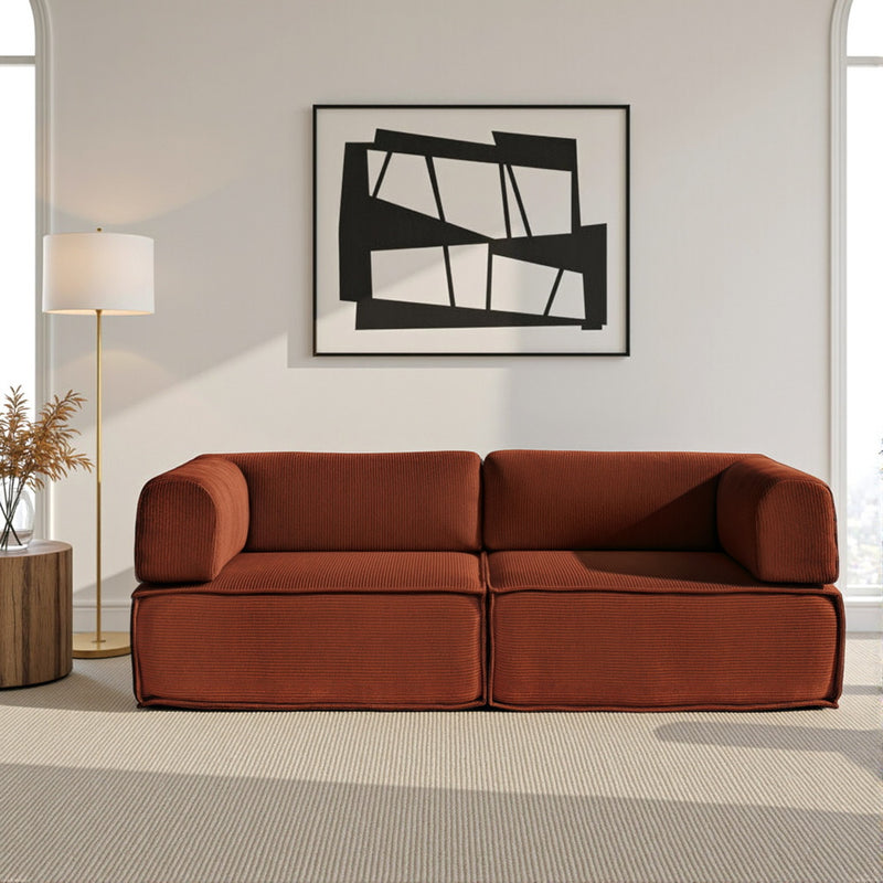Convertible Folding Sofa Bed Orange in modern living room with minimalist black and white abstract wall art and floor lamp
