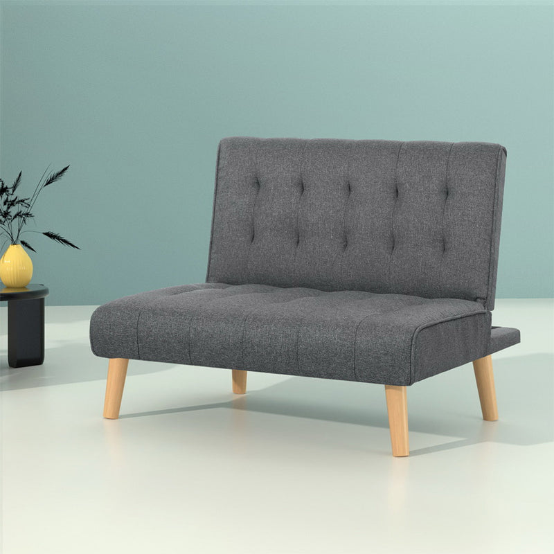 Grey upholstered Sofa Lounge Recliner Futon Chair with tufted backrest and wooden legs on light background