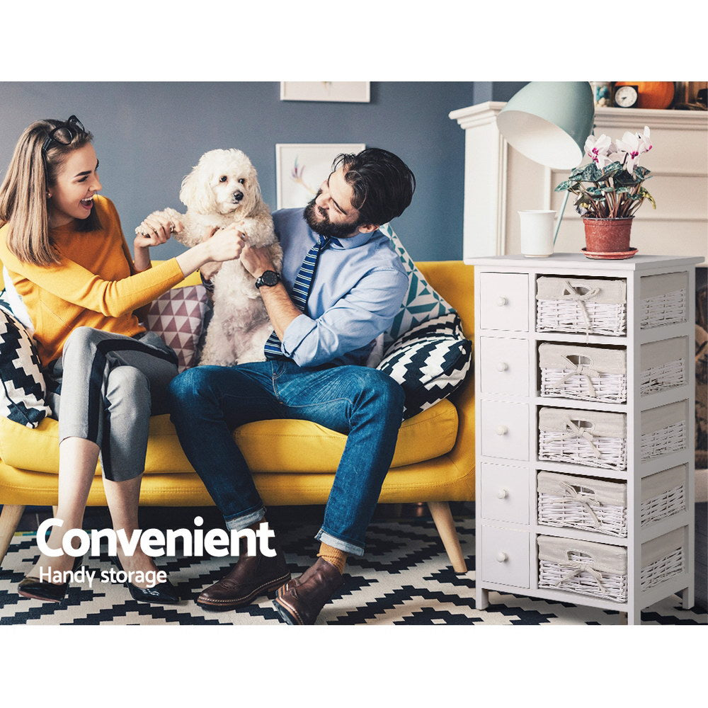 5 Basket Storage Drawers - White tallboy with wicker baskets beside couple playing with dog on yellow sofa