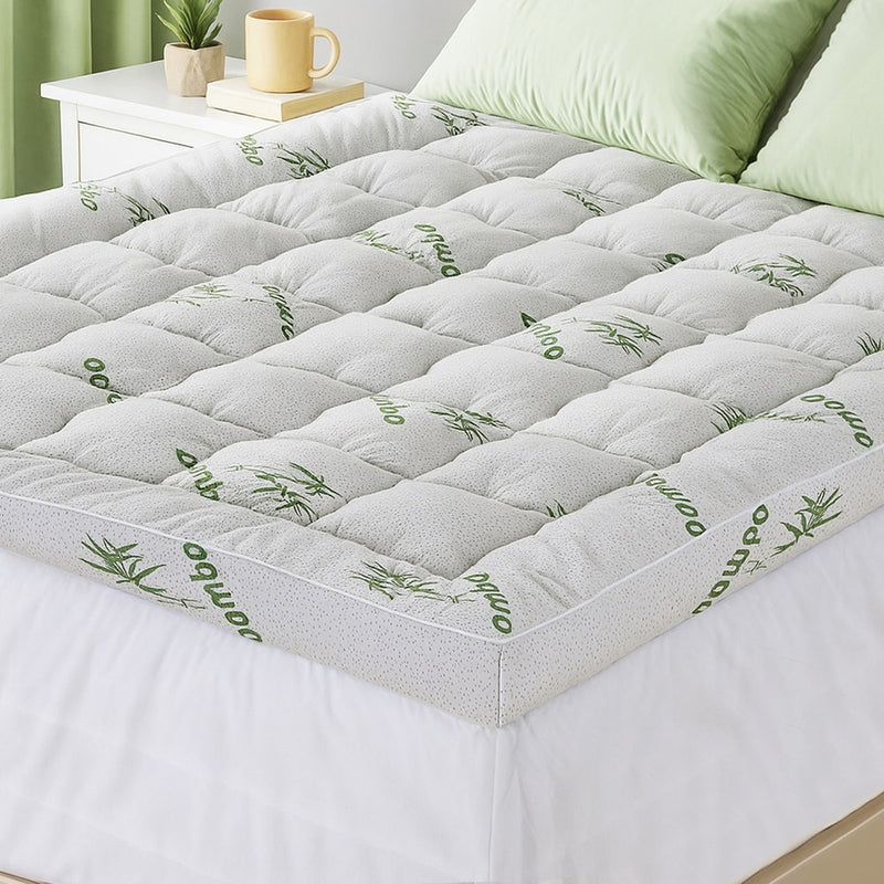 Mattress Topper 11cm Pillowtop toppers Bamboo Queen with quilted surface on bed, shown in bedroom setting with pillows and side table