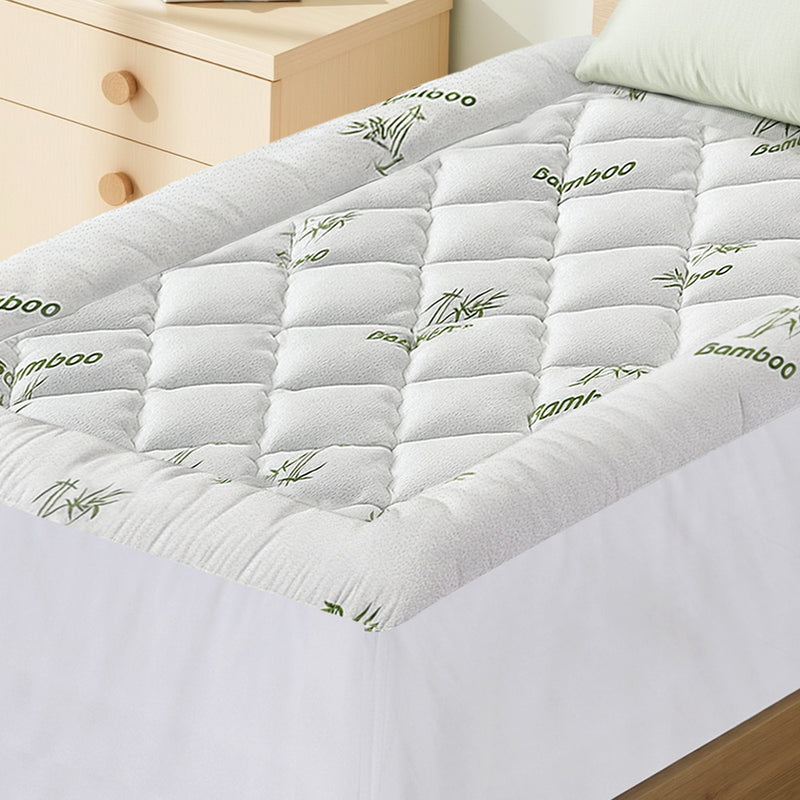 Mattress Topper 5cm Pillowtop toppers Bamboo Single with quilted bamboo cover on a white bed in bedroom setting