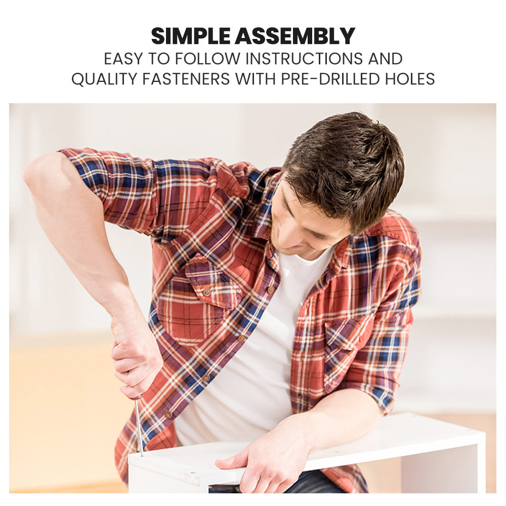 Man assembling Wooden Kids Single Loft Bed Frame - Hiding Space Underneath with Interchangeable Pink and Blue Curtains with screwdriver